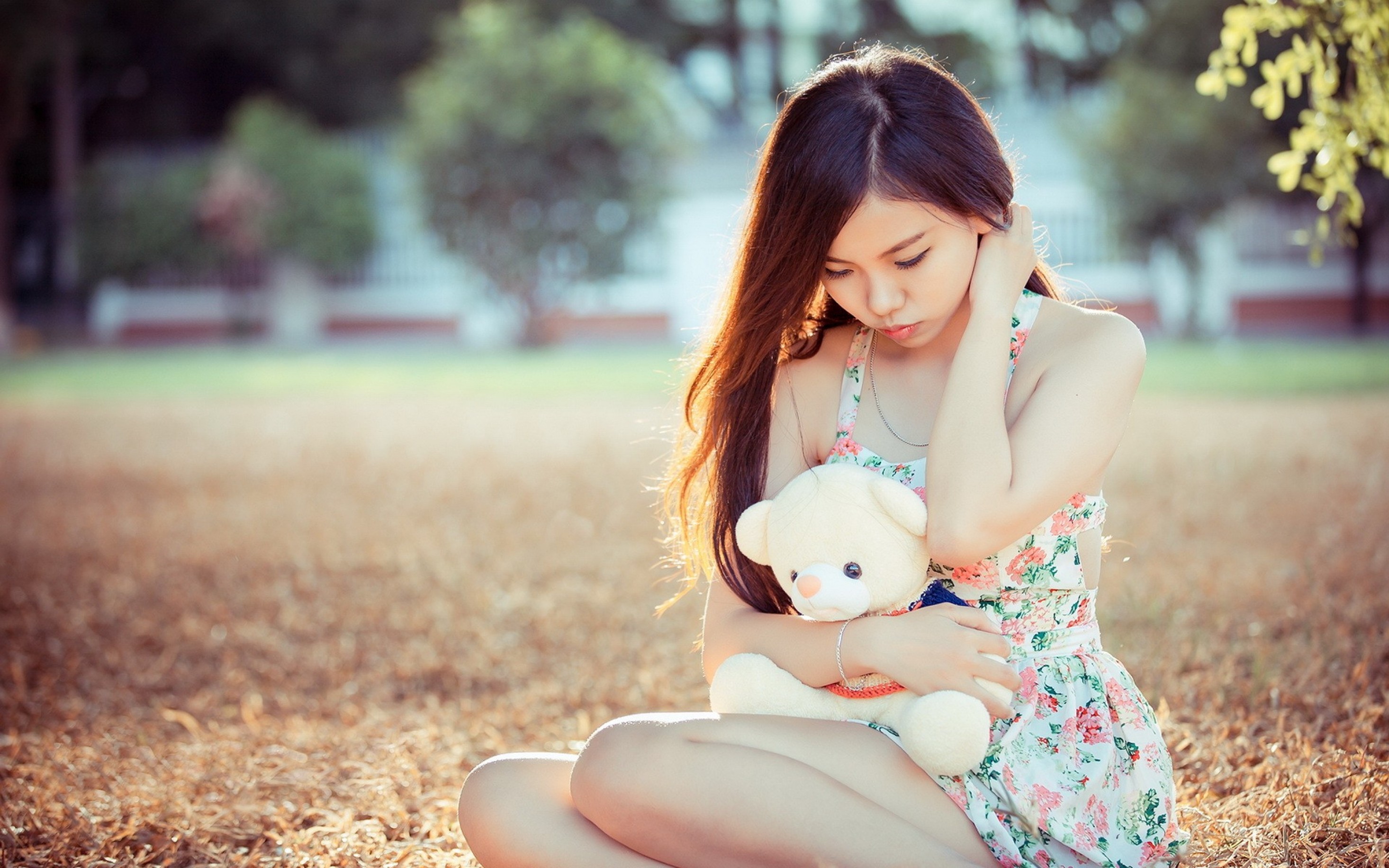 Asian teen girl with teddy bear.